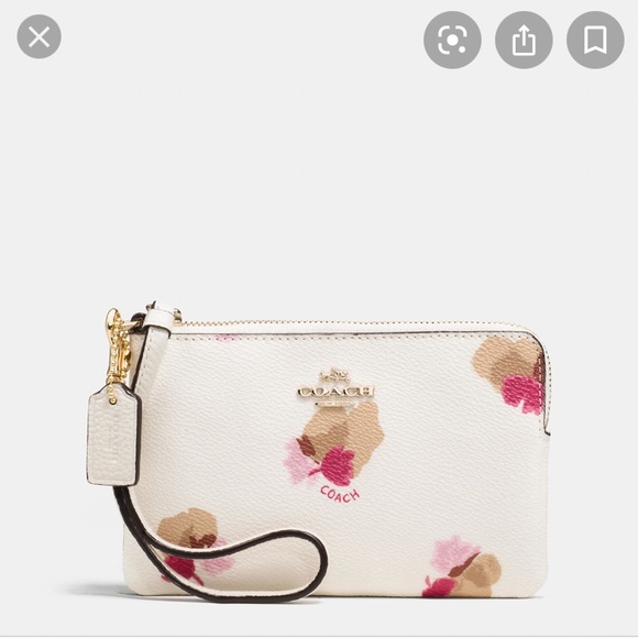 Coach Handbags - Coach white leather wristlet with flowers 🌸
